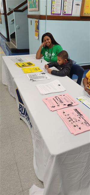 Family Center Representative at information table 